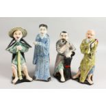 A SET OF FOUR CHINESE FIGURES, three men and a lady. 10ins high.