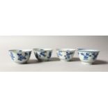 A GROUP OF FOUR CHINESE KANGXI PERIOD SHIPWRECK BLUE & WHITE PORCELAIN TEABOWLS , each painted