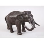 A GOOD JAPANESE LATE MEIJI PERIOD BRONZE ELEPHANT OKIMONO, the elephant in striding position, the
