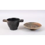 A GOOD EARLY ROMAN CUP AND ASSOCIATED SAUCER , the cup with moulded handles and a dark green