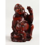 A GOOD CHINESE CARVED WOOD BUDDHA. 5ins high.