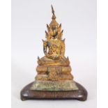 A GOOD 18TH / 19TH CENTURY THAI GILT BRONZE BUDDHA / DEITY, sat in a meditating position on a