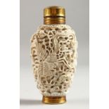 A FILIGREE SNUFF BOTTLE with dragon design.