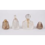 A COLLECTION OF FOUR MUGHAL INDIAN CARVED ROCK CRYSTAL SCENT BOTTLES.
