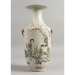 A CHINESE VASE painted with figures and calligraphy. 10.5ins high.