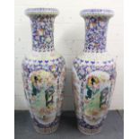 A LARGE PAIR OF 20TH CENTURY FLOOR-STANDING FAMILLE ROSE VASES depicting female figures and