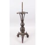 A LARGE CHINESE MING DYNASTY BRONZE TRIPOD CANDLESTICK, supported on Buddhistic lion-head feet,