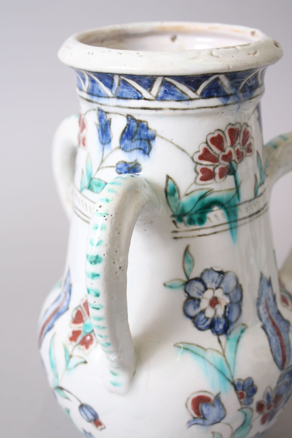 A PAIR OF IZNIK STYLE POTTERY THREE HANDLED VASES, 25cm high. - Image 4 of 4