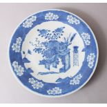 A 19TH CENTURY CHINESE BLUE & WHITE DISH, decorated with arrays of ikebana and