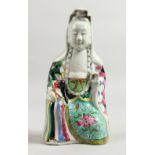 AN 18TH CENTURY FAMILLE ROSE FIGURE OF GUANYIN. 8ins high.