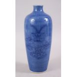 A CHINESE DARK BLUE GROUND UNDERGLAZE PAINTED PORCELAIN VASE, the underglaze decoration depicting