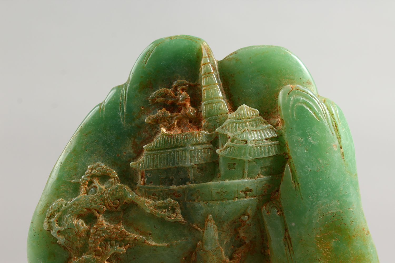 A CARVED GREEN STONE GROUP with four figures. 8.5ins high. - Image 2 of 8