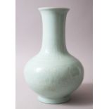 A CHINESE CELADON GROUND & MOULDED QIANLONG STYLE PORCELAIN BOTTLE VASE, with moulded panels of