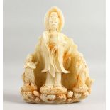 A CHINESE WHITE JADE CARVING OF GUANYIN AND TWO GODS, 10.5ins high.