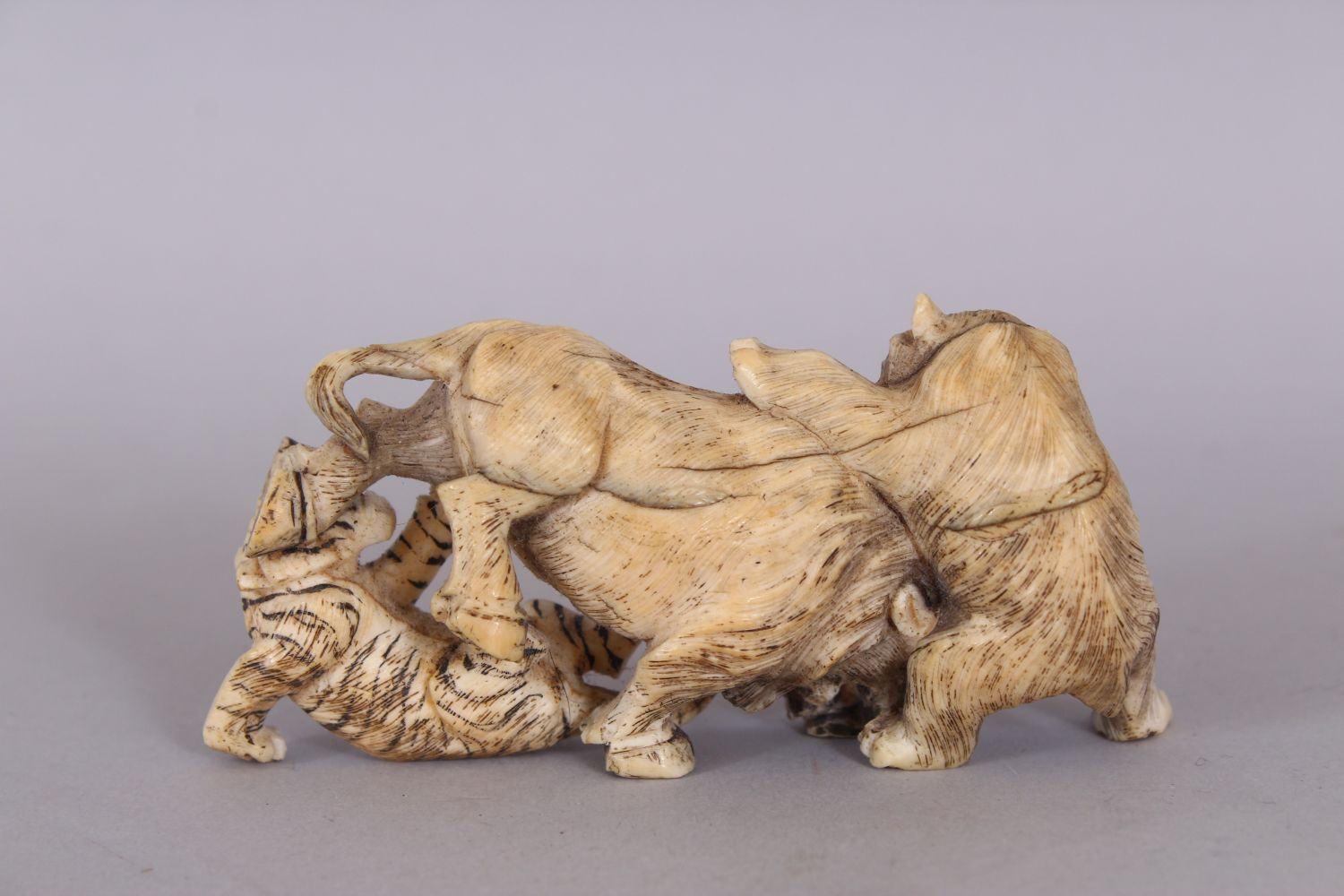 A JAPANESE MEIJI PERIOD IVORY OKIMONO OF A BEAR & A TIGER ATTACKING A BOAR, the details - Image 3 of 4