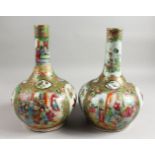 A VERY GOOD PAIR OF 19TH CENTURY CANTON BOTTLE VASES with various panels of flowers, insects,