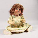 HEUBACH KOPPELSDORF. A BISQUE HEADED DOLL with clothes. Stamped Herbert Koppelsdorf 320. 3/0