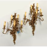 A PAIR OF ROCOCO STYLE ORMOLU FIVE BRANCH WALL APPLIQUES. 70cms high.