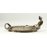 AN ART NOUVEAU BRONZE DISH, with a crocodile and a nude young lady. 15ins long.