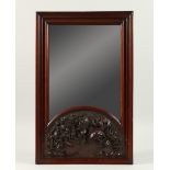 A SMALL LATE 19TH CENTURY CARVED MAHOGANY WALL MIRROR. 53cms high x 34cms wide.