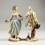 A PAIR OF 19TH CENTURY MEISSEN FIGURES OF A GALLANT AND LADY, the lady holding a sprig of flowers,
