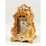 A SEVRES STYLE ORMOLU CARRIAGE CLOCK, with pink porcelain panels, and a repeat movement. 23cms