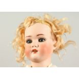 SIMON & HALBIG A BLONDE HAIR BISQUE HEADED DOLL, S. & H. No. 9, with articulated body. 1ft 10ins