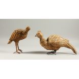 TWO CARVED WOOD MODELS OF BIRDS, LATE 19TH CENTURY, on metal feet. 15cms and 30cms long.