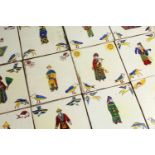 A COLLECTION OF SIXTY-EIGHT COLOURED TILES, with Chinese figures, birds etc., each 6ins square.