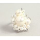 A SILVER BAROQUE PEARL RING.