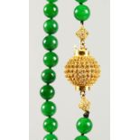 AN APPLE GREEN JADE NECKLACE, with 18ct gold clasp. Beads approx. 10mm. Overall Length: 86cms.