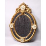 A DECORATIVE, LARGE OVAL FRENCH STYLE GILT FRAMED MIRROR, 20TH CENTURY, with mirrored slips and four