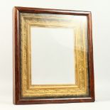 A 19TH CENTURY ROSEWOOD AND GILT GESSO PICTURE FRAME. Overall: 45cms x 40cms. Rebate: 30cms x 24.