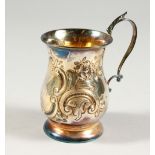 A CHRISTENING MUG, with floral repousse decoration. Chester 1914.