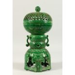A GREEN GLAZED POTTERY CENSER, with pierced cover. 30cms high.