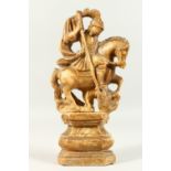 AN EARLY CARVED ALABASTER GROUP, "GEORGE SLAYING THE DRAGON". 30cms high.