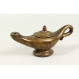 A BRONZE "ALADDINS LAMP" JUG. 28cms long.