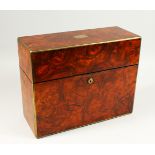 A GOOD EARLY 19TH CENTURY WALNUT AND BRASS BOUND TANTALUS, the hinged top opening to reveal three