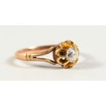 AN 18CT GOLD DIAMOND RING.