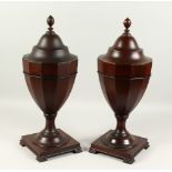 A PAIR OF GEORGE III DESIGN MAHOGANY URN SHAPE CUTLERY BOXES. 58cms high.