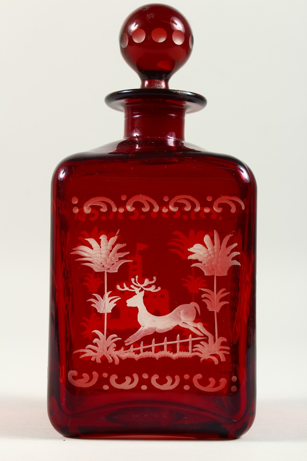 A BOHEMIAN SQUARE SHAPE RUBY GLASS DECANTER, engraved with a castle and a deer. 19cms high. - Image 4 of 9