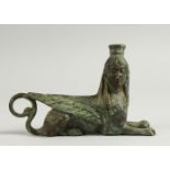 AFTER THE ANTIQUE A SMALL BRONZE SPHINX STYLE MODEL. 13cms long.