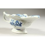A RARE 18TH CENTURY WORCESTER BLUE AND WHITE SAUCEBOAT, 7.5ins long, combining Fisherman and