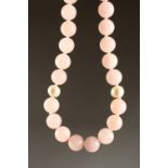 A GOOD STRING OF QUARTZ PINK TWENTY SIX AND TWO PEARLS.