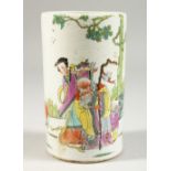 A PORCELAIN CYLINDRICAL BRUSH POT, painted with figures and calligraphy. 14cms high.