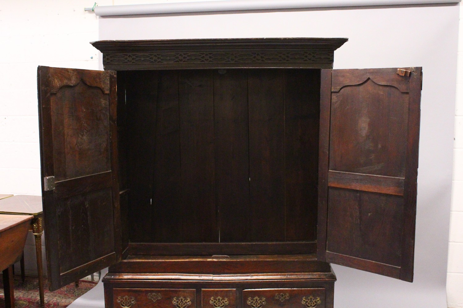 AN 18TH CENTURY OAK BACON CUPBOARD, with a moulded cornice, blind fret decorated frieze above a pair - Image 7 of 13