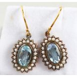 A PAIR OF 9CT GOLD AND SILVER, BLUE TOPAZ AND PEARL DROP EARRINGS.