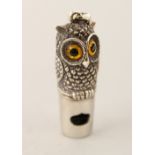 A SILVER OWL WHISTLE.