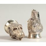 A PAIR OF SOLID SILVER DOG STIRRUP CUP SALT AND PEPPERS.