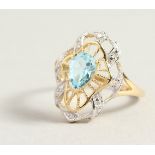 A 9CT GOLD, TOPAZ AND DIAMOND FILIGREE RING.